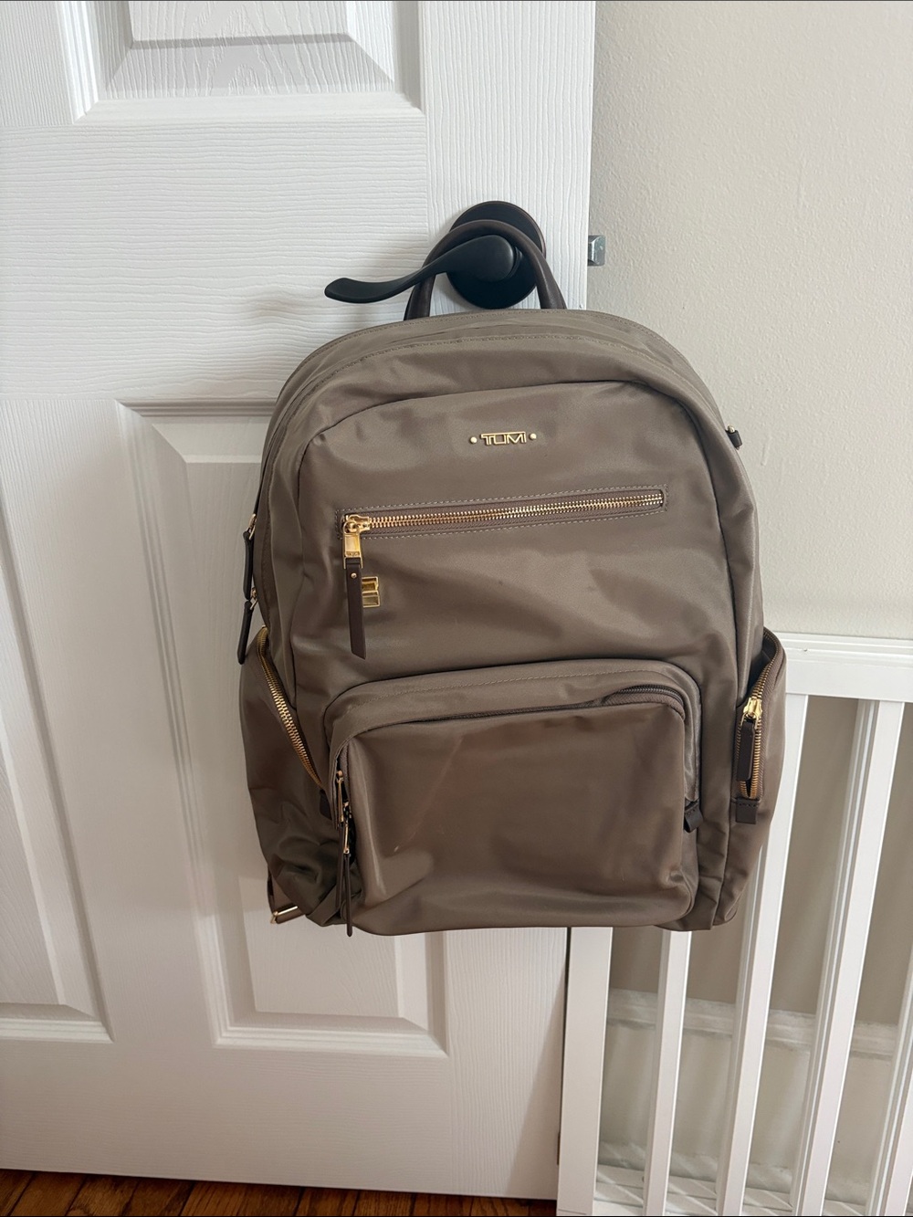 Tumi Women's Taupe backpack.